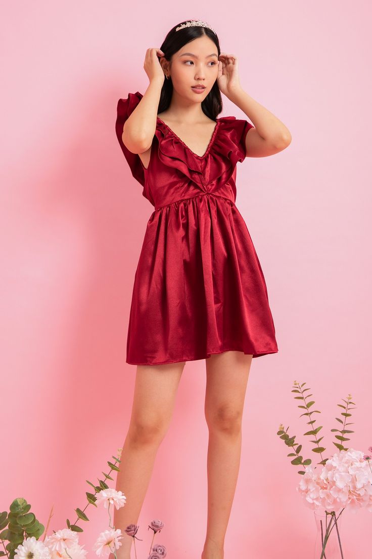 Make a statement in this fanciful V-neck ruffles dress made from lustrous, textured satin. Featuring layered ruffles adorned the front and back neckline, finished with a delicate back ribbon, this dress is a versatile option for any soirée, from a garden party to an evening date. Inches (in) Size Bust Waist Hip XS 31" 23" 33" S 33" 25" 35" M 35" 27" 37" L 37" 29" 39" XL 39" 31" 41" Centimeters (cm) Size Bust Waist Hip XS 78 cm 58 cm 83 cm S 83 cm 63 cm 88 cm M 88 cm 68 cm 93 cm L 93 cm 73 cm 99 Summer Satin Dresses With Ruffled Straps, Summer Satin Dress With Ruffled Straps, Satin Summer Dress With Ruffled Straps, Satin Dress With Ruffled Straps For Summer, Glamorous Mini Dress With Ruffles And Ruffled Straps, Glamorous Mini Dress With Ruffled Straps, Satin V-neck Mini Dress With Satin Finish, Elegant Satin Dress With Ruffled Skirt, Chic Bridesmaid Dress With Ruffled Skirt