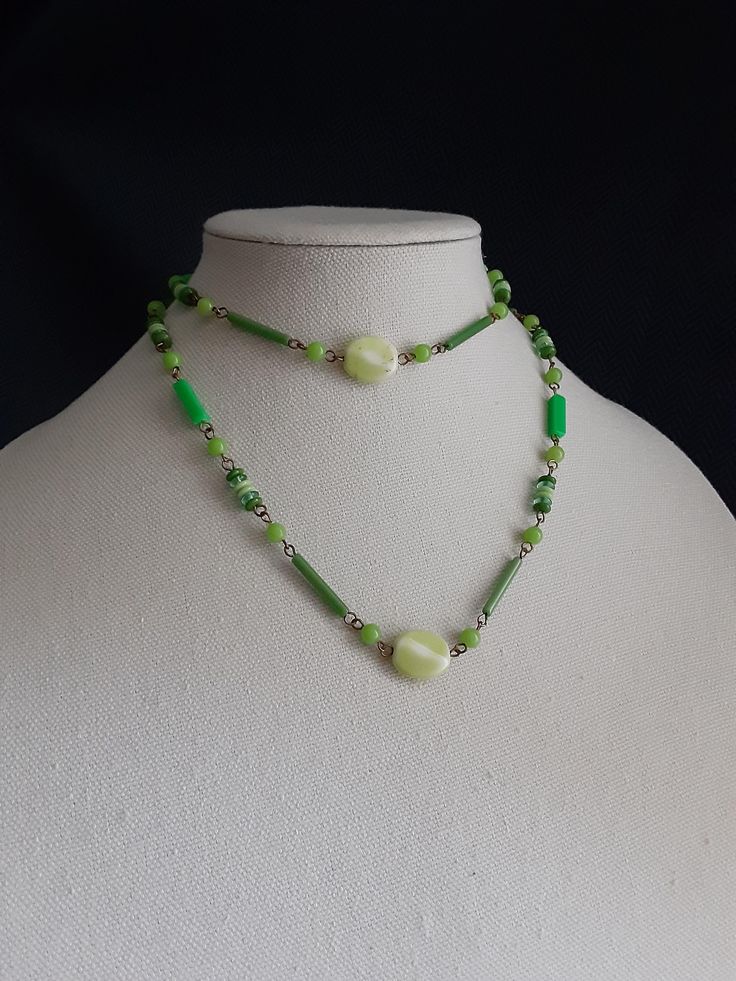 Vintage Lime Green Plastic Beaded Necklace - Gold Tone Wire Spacers. There are several shapes and multi shades of green in the beads. Measures 34 inches long. Has no clasp. In good used condition. Please take a look at our photos for overall condition.  Please feel free to ask us any questions you might have about this set! Ships 3-5 business days after purchase via USPS. Thank you so much for visiting our shop! Green Beaded Long Necklace With Faceted Beads, Green Long Beaded Necklaces With Faceted Beads, Adjustable Green Beads Long Necklace, Green Long Beaded Necklace With Faceted Beads, Green Long Necklace With Faceted Beads, Vintage Green Single Strand Necklace, Green Long Beaded Necklace With Large Beads, Long Green Beaded Necklace With Large Beads, Green Single Strand Long Beaded Necklace