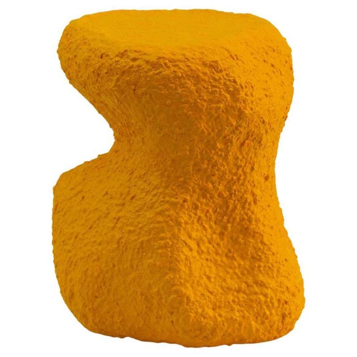 a yellow object that looks like it is made out of cement