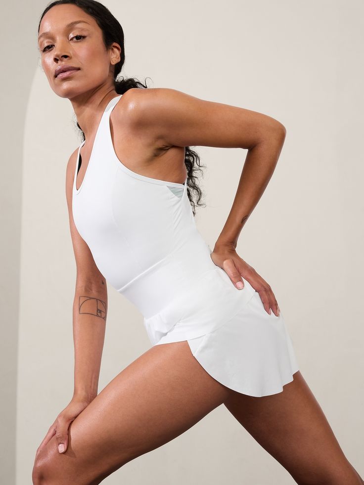 FOR: High-intensity training and running FEEL: Recycled SuperSonic fabric is sleek with supportive compression FAVE: Built-in brief eliminates flash factor Back waistband secure zip pocket to store your essentials Pair with your favorite sports bra Relaxed with room to move One piece shorts romper. White Activewear With Built-in Padding And 4-way Stretch, Tennis Activewear With Built-in Shorts And Stretch, Fitted Racerback Activewear With Built-in Shorts, Fitted Running Activewear With Built-in Padding, Sporty Tennis Activewear With Built-in Shorts, Tennis Activewear With Built-in Shorts, White Tennis Activewear With Built-in Shorts, Fitted Athleisure Activewear For Light Sports, Fitted Athleisure For Light Sports