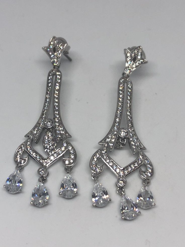 Vintage chandelier earrings silver diamond look Austrian crystal Handmade vintage silver rhodium over white bronze Crystal earrings These really look like white gold with diamond accents About 2.25 long All jewelry is shipped in a nice gift box. Check out our over a THOUSAND great reviews Classic Drop Chandelier Earrings With Diamond Accents, Classic Chandelier Earrings With Diamond Accents For Evening, Classic Diamond White Chandelier Earrings, Classic Diamond White Chandelier Earrings With Diamond Accents, Formal Diamond White Chandelier Earrings For Pierced Ears, Diamond White Crystal Chandelier Earrings For Anniversary, White Crystal Chandelier Earrings For Formal Occasions, Formal White Crystal Chandelier Earrings, Dazzling Silver Chandelier Earrings With Cubic Zirconia