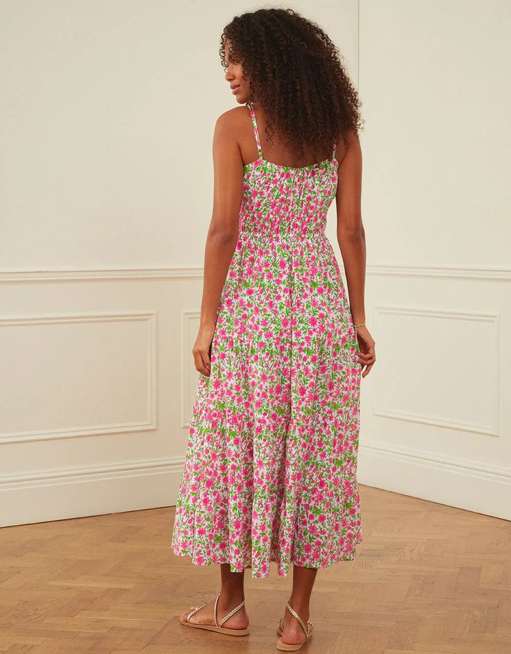 Block-printed by hand in the much-loved Lolita print, the Seychelles dress is a summer favorite you won’t want to take off. We love the pop of neon pink set against the zesty green in this vibrant print. Finished with adjustable spaghetti straps, a full, tiered skirt and rows of elastic under the bust, the Seychelles dress is an effortless and flattering piece you’ll wear again and again. Perfect for beach holidays, warmer days ahead and evenings out. Pink City Prints was founded to preserve the Beachwear Midi Dress For Summer Parties, Summer Midi Dress With Tropical Print, Summer Tropical Print Midi Dress, Pink Summer Midi Dress For Parties, Pink Midi Dress For Summer Parties, Tropical Dress With Vibrant Print For Day Out, Pink Midi Dress For Spring Summer Parties, Pink Midi Dress For Spring And Summer Parties, Multicolor Midi Dress For Summer Parties