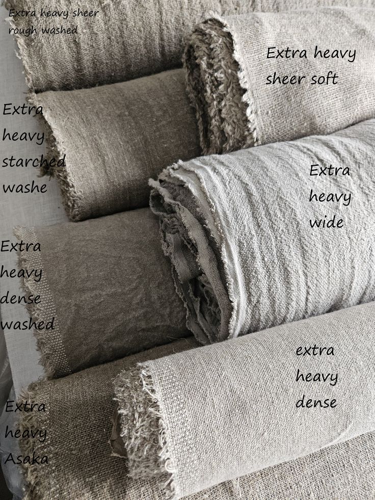 several different types of towels stacked on top of each other, labeled with words describing them