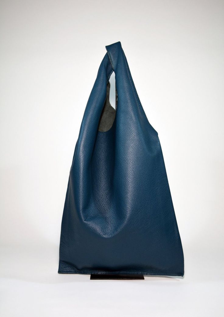 This Large Leather shoulder Hobo Bag-Teal is designed for women who love to pack heavy. No need to say that it fits all your daily essentials and more. Enjoy your day to work, the gym, or the beach whilst looking sleek and chic. Raw edges and no lining makes this style super light and easy to fold when traveling. Details:Color: tealSoft & pebbly genuine Italian cow leatherLaser Cut edgesNatural unlined interiorDimensions:Width: 18.5 inch (47cm)Height: 19.6 inch (50 cm). Including shoulder st Versatile Blue Leather Hobo Bag, Blue Leather Hobo Bag For Daily Use, Modern Blue Leather Hobo Bag, Eco-friendly Blue Bag With Leather Handles, Blue Hobo Bag With Leather Handles For On-the-go, Interior Dimensions, Enjoy Your Day, Leather Hobo Bag, Leather Hobo