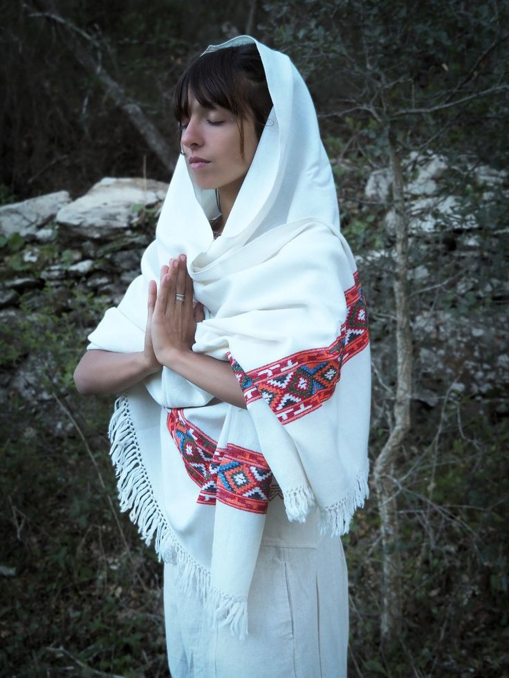 Big cosy woolen shawl adorned with beautiful tribal hand embroidery. Ethically made by a small co-operative in the Himalayan mountains of India supporting the livelihood of the workers with fair salaries.  With an authentic design and the use of high quality local sheep wool from Himalayan mountain sheep, these beautiful shawls are created using ancient hand loom weaving techniques passed down through generations. Warm, soft and nice feel on bare skin. SIZE: Width: 38 inch (96.5 cm) Length: 87 i Traditional Winter Shawl, Bohemian Shawl With Embroidered Border For Festival, Traditional White Scarves For Winter, Bohemian Pashmina Shawl With Traditional Drape For Winter, Bohemian Pashmina Shawl With Multicolor Embroidery, Traditional Shawl With Woven Motifs For Ceremonies, Traditional Pashmina Shawl With Traditional Patterns For Winter, Winter Bohemian Pashmina Shawl With Traditional Drape, White Bohemian Pashmina Shawl For Festive Occasions