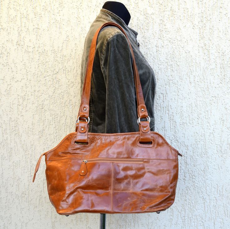 Vintage Leather Bag Top Handle Leather Bag Brown shoulder bag Large size leather hobo bag shoulder bag purse Condition: graet vintage condition Brand: The Monte Measurements(approx): Width: 49 cm/19" Hight: 27 cm/10,4" Depth: 15 cm/6" Strap length: 74 cm/29"  Materials:  Outer: leather If you have any questions feel free to ask. SHIPPING * I ship worldwide via Priority mail (Latvijas Pasts) from Latvia (EU). * I ship from Europe, so please allow 2 to 4 weeks for the package to arrive if you live overseas. * Europe 5 - 10 business days. X177 Vintage Brown Bag, Vintage Leather Bag, Brown Shoulder Bag, Leather Hobo Bag, Leather Hobo, Bag Shoulder, Hobo Bag, Vintage Leather, Large Bags