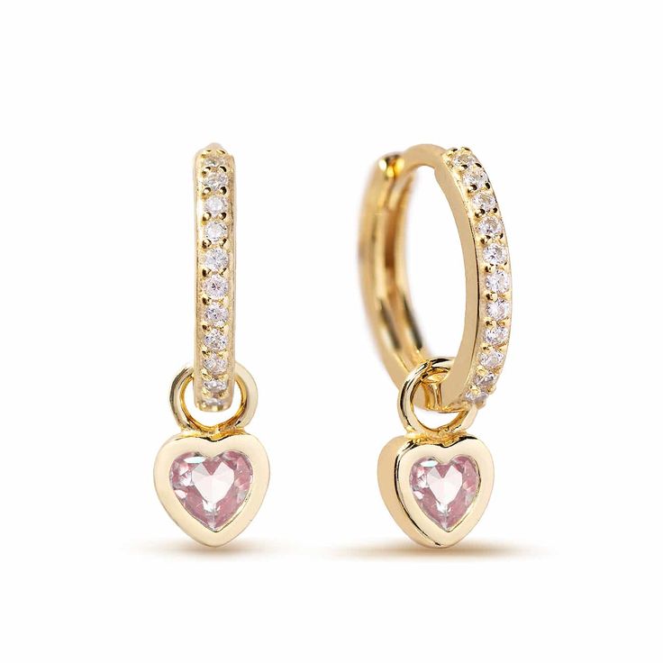 A tiny pink bezel set heart charm dangles from pavé huggie hoop earrings| Lead and Nickel free.Sold as a PAIR Gold Vermeil (Thick layer of Gold plated over Sterling Silver) Pink Sapphire Cubic Zirconia Gemstone Heart Charm 5mm(0.2in) Hoop: Inside Diameter 9mm(0.35in), Thickness 1.5mm(0.06in) Hinge closure #E445-GPK Cute Huggie Jewelry For Valentine's Day, Pink Small Hoop Jewelry For Anniversary, Dainty Pink Hoop Jewelry, Dainty Pink Huggie Earrings As Gift, Dainty Pink Hoop Earrings For Everyday, Pink Huggie Earrings For Anniversary, Pink Huggie Hoop Earrings For Anniversary, Cute Huggie Heart Earrings With Charm, Pink Huggie Heart Earrings As Gift