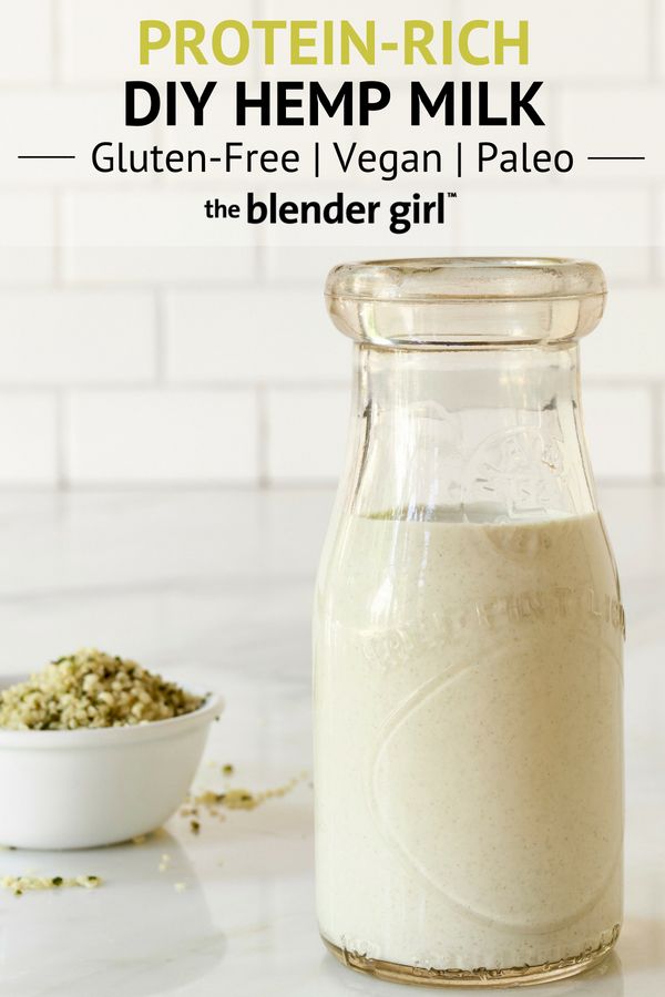 a bottle of protein - rich diy hemp milk next to a bowl of seeds