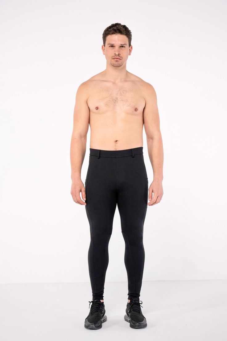 Description: Men’s Equestrian Style Black Fashion Leggings Two Thigh Pockets Jodphur Style Panelling and Belt Loops Rayon / Nylon / Spandex Adjustable Drawstring Zero Transparency Machine Wash Cold Model 1 is 6' (183cm) tall, 36’’ (91cm) waist size, 200lbs (90kg) and wears size Large. Black Tight Elastane Bottoms, Tight Black Elastane Bottoms, High Stretch Footless Bottoms, Snug Fit Full-length Training Leggings, Snug Fit Full Length Leggings For Training, Fitted Black Sports Bottoms, Casual Fitted Training Bottoms, Fitted Black Gym Pants, Black Compression Pants With High-cut Leg