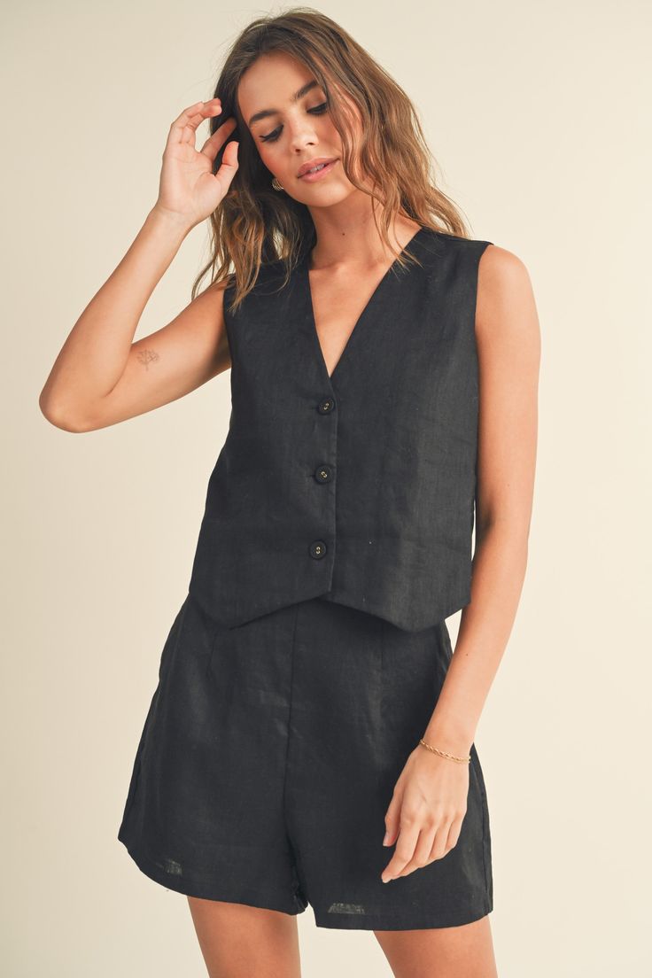 Expertly crafted with 100% linen, this summer vest will keep you cool and stylish. The tuxedo style 3 button design adds a touch of sophistication, perfect for any occasion. Pair it with our matching linen pants for a complete and effortless look. Stay cool and comfortable this season with our Linen Summer Vest. Black Sleeveless Linen Vest, Black Linen Spring Vest, Black Linen Sleeveless Tank Top, Chic Summer Linen Vest, Tailored Linen Vest For Spring, Black Linen Casual Tank Top, Casual Black Linen Tank Top, Tailored Linen Spring Vest, Tailored Sleeveless Linen Vest