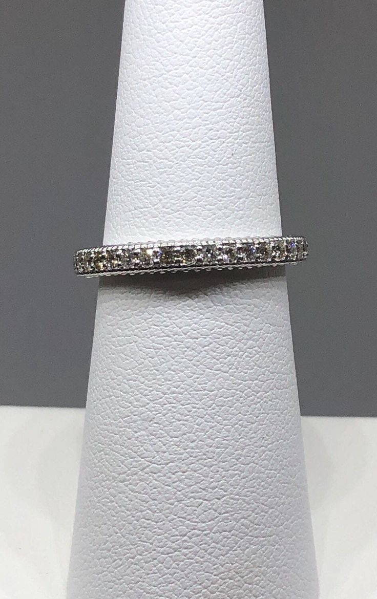 Victorian/ Vintage style wedding band with milligrain design Stackable diamond ring. 14k solid white gold. Weighs Approximately 3 grams. 18 brilliant round diamonds set in prong setting. 0.28 carats total diamond weight. Average quality used: SI. Comes in a nice box. Comes with warranty. Fast shipping available upon request. White Platinum Eternity Band With Diamond Accents, White Diamond Ring With Round Band And Accents, Classic Eternity Band With Pave Setting For Anniversary, Round Eternity Band With Pave Setting For Anniversary, Diamond White Stackable Rings With Pave Setting, Classic White Diamond Eternity Band, Classic Diamond White Eternity Band With Pave Setting, Classic Eternity Band With Pave Setting, Platinum Eternity Band With Pave Setting For Formal Occasions