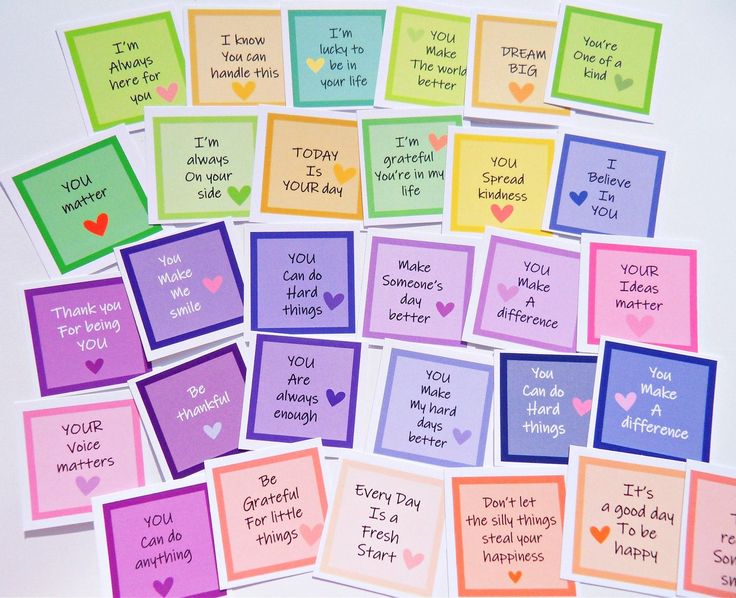 many different colored cards with words on them and hearts in the middle one has an i love you message