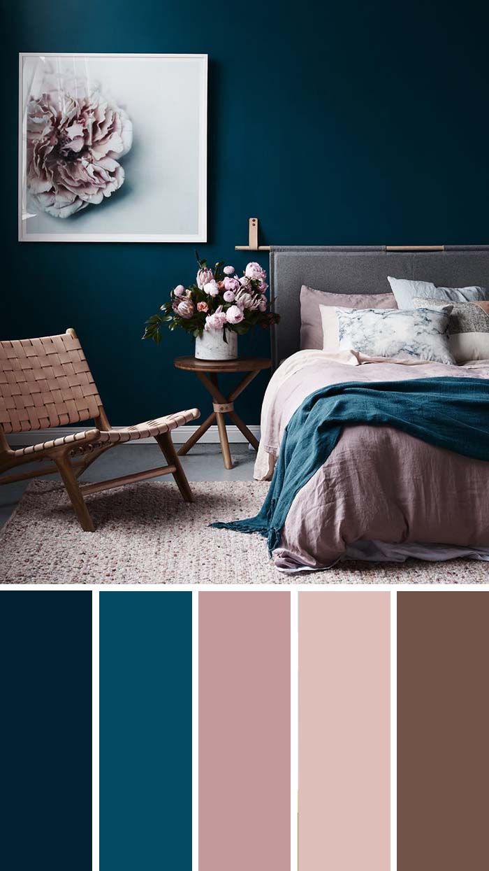 a bedroom with blue walls and pink accents