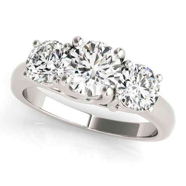 three stone diamond ring with four stones on each side and the center stone in white gold