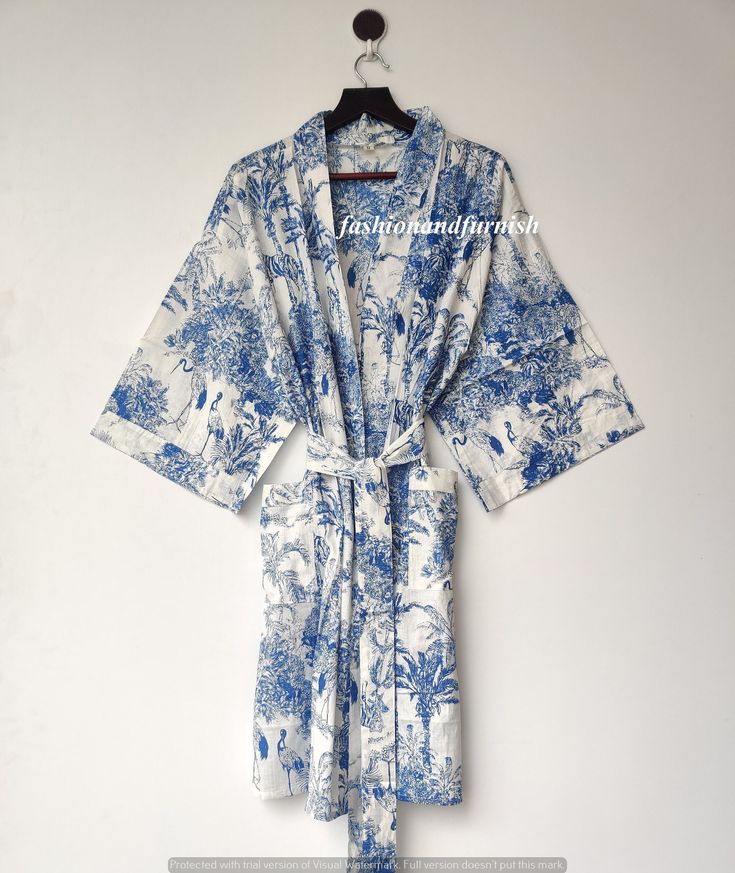 ITEM DESCRIPTION: These Cotton Floral Print Robes are luxurious and sweet, and will make you and your bridesmaids feel like you're blossoming flowers ! These robes are perfect for bridesmaids gifts, birthday gifts, and perfect gifts for girls who are in college. A beautiful lightweight cotton kimono-style hand-printed dressing gown. The gown is 100 cms length and 120 cms wide / bust approx. Features two front pockets, belt and loops. This soft cotton fabric is from India. Fabric has soft touch. Blue Cotton Sleep Kimono, White Robe With Kimono Sleeves For Home, Printed Cotton Robe For Home, White Sleepwear With Kimono Sleeves For Loungewear, Cotton Kimono With Kimono Sleeves For Loungewear, Cotton Floral Print Kimono For Daywear, White Kimono Sleeve Sleepwear For Home, Summer Cotton Sleep Kimono, White Sleepwear With Kimono Sleeves