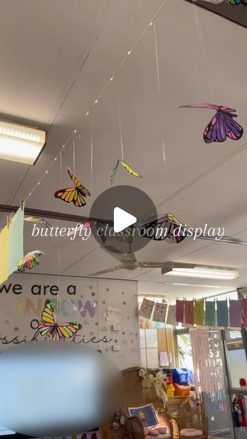 there are many butterflies hanging from the ceiling