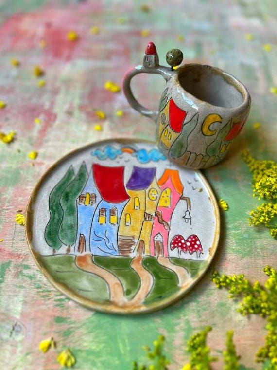 a cup and saucer sitting on top of a table