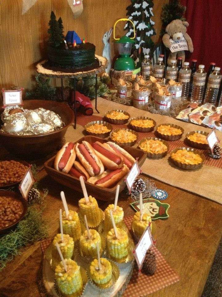 a table filled with lots of food and desserts