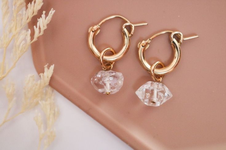 Now you can grab a set of our bestselling 14k Gold Filled Huggie Hoops and our gorgeous new dangles in one convenient set! Set includes one pair of gold huggies, one pair of freshwater pearl dangles, and one pair herkimer diamond dangles! Now you can switch out your earring style by simply sliding off one dangle and sliding on a new one! Or wear the huggies all on their own! It's 3 looks in 1! D E T A I L S 14k Gold Fill: hypoallergenic, anti-tarnish, nickel free SET INCLUDES: 1 pair gold filled Gold Huggies, Ear Art, Huggie Earrings Gold, Diamond Huggie Earrings, Diamond Quartz, Hoop Earring Sets, Diamond Charm, Quartz Crystals, Huggie Earrings