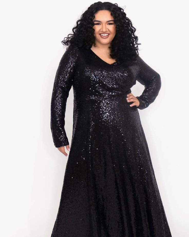 You will steal the spotlight at any formal occasion in this sleek long sleeve sequin formal gown. Finally, a fancy dress with the long sleeves you have been having trouble finding. Deep V-neckline and soft A-line skirt flatter your curves.  Soft, stretch knit lining guarantees you're comfortable all night long.  A must-have! Round out your vacation and weekend wardrobe with this plus size dress Celebrations by Sydney's Closet Uptown Evening Dress | Black | Dresses | Materials & Care Instructions Long Sleeve Evening Dress For Gala In Winter, Long Sleeve Evening Dress For Winter Gala, Long Sleeve Sequin Evening Dress For Fall, Long Sleeve Sequin Dress For Fall Evening, Long Sleeve Winter Evening Dress For Gala, Fall Evening Long Sleeve Sequin Dress, Sequin Evening Dress For Fall Gala, Glamorous Long Sleeve Sequin Formal Dress, Winter Evening V-neck Dress