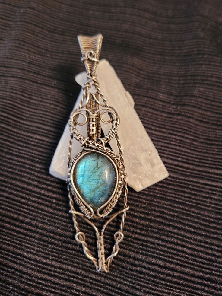 Beautiful blue labradorite Pendant in antiqued. 999 fine silver.  Comes with free black wax cord necklace, polishing cloth, and gift box. Antique Silver Handmade Artisan Jewelry, Handmade Artisan Jewelry In Antique Silver, Handmade Artisan Antique Silver Jewelry, Artisan Handmade Antique Silver Jewelry, Handmade Antique Silver Spiritual Jewelry, Handmade Spiritual Antique Silver Jewelry, Antique Silver Jewelry With Natural Stones, Handmade Antique Silver Pendant Jewelry, Unique Handmade Antique Silver Jewelry