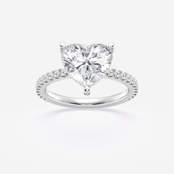 Introducing our Hidden Halo Heart Cut Engagement Ring, where elegance meets brilliance! Crafted with love and care, this exquisite piece is a true symbol of everlasting commitment. The captivating Heart cut center stone is surrounded by a delicate halo of shimmering Lab Grown diamonds, adding a touch of magic to your special moment. With its sleek design and timeless allure, this ring is destined to steal hearts and create cherished memories. Celebrate your love story with a touch of sophisticat Heart Cut Lab Grown Diamond Wedding Ring, Elegant Brilliant Cut Diamond Ring For Valentine's Day, Classic Heart-shaped Diamond White Wedding Ring, Fine Jewelry Moissanite Heart Ring For Wedding, Fine Jewelry Wedding Heart Ring In Moissanite, Moissanite Heart Ring For Wedding With Round Cut, Fine Jewelry Heart Ring In Moissanite For Wedding, White Gold Moissanite Heart Ring For Wedding, Luxury Heart Cut Diamond Heart Ring