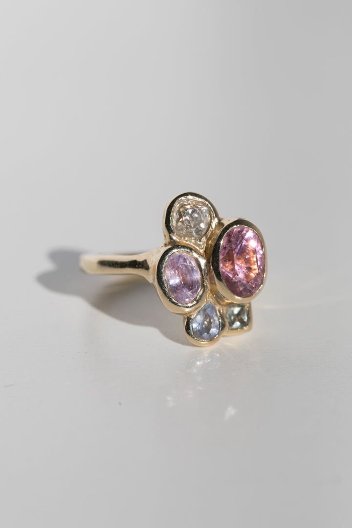 Be bold and unique with the Tidepool Ring. This customizable gemstone cluster ring is handmade with your choice of stones. Add a luxe touch to your wardrobe with an extraordinary and one-of-a-kind piece. This product page is for the setting. Once your order is placed for the setting, our team will be in touch to discuss stone selection. Once your stones are chosen, you will be sent a second invoice for the price of your gems. If you have an ideal budget in mind for the stones, we are happy to di Luxury Handmade Birthstone Engagement Ring, Maggie Simpkins Rings, Unique Pink Multi-stone Rings, Luxury Multi-stone Cluster Ring, Unique Gemstone Cluster Ring In Yellow Gold, Fine Jewelry 14k Gold Multi-stone Cluster Ring, Luxury 14k Gold Multi-stone Cluster Ring, Luxury Multi-stone Cluster Ring In 14k Gold, 14k Gold Multi-stone Cluster Ring