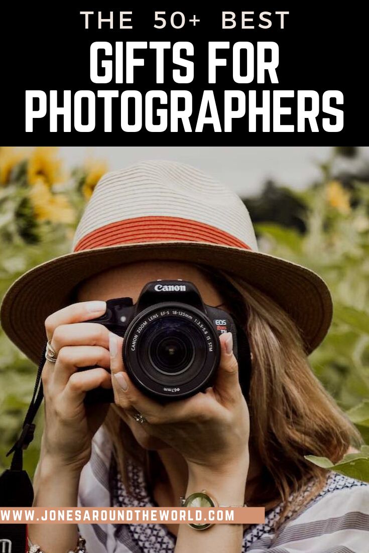 a woman taking a photo with her camera and text overlay reads the 50 best gifts for photographers