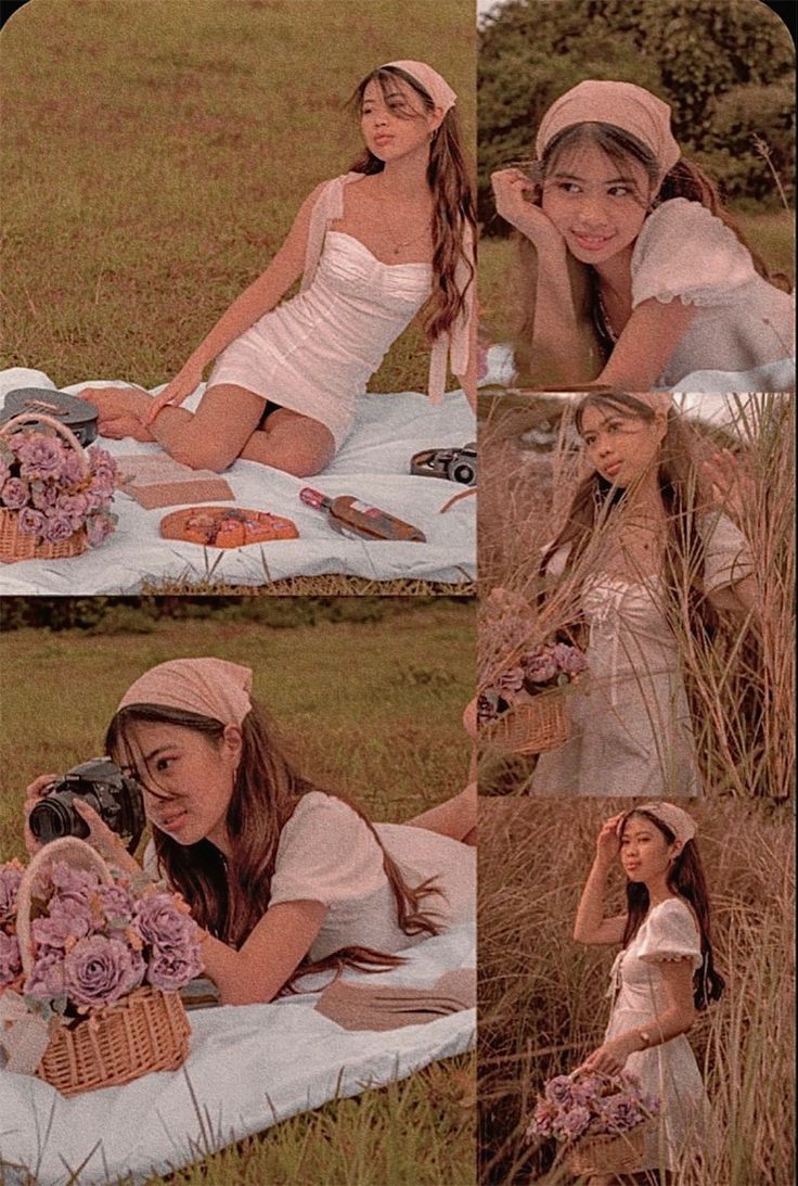 two young women sitting on a blanket in the grass with flowers and other items around them