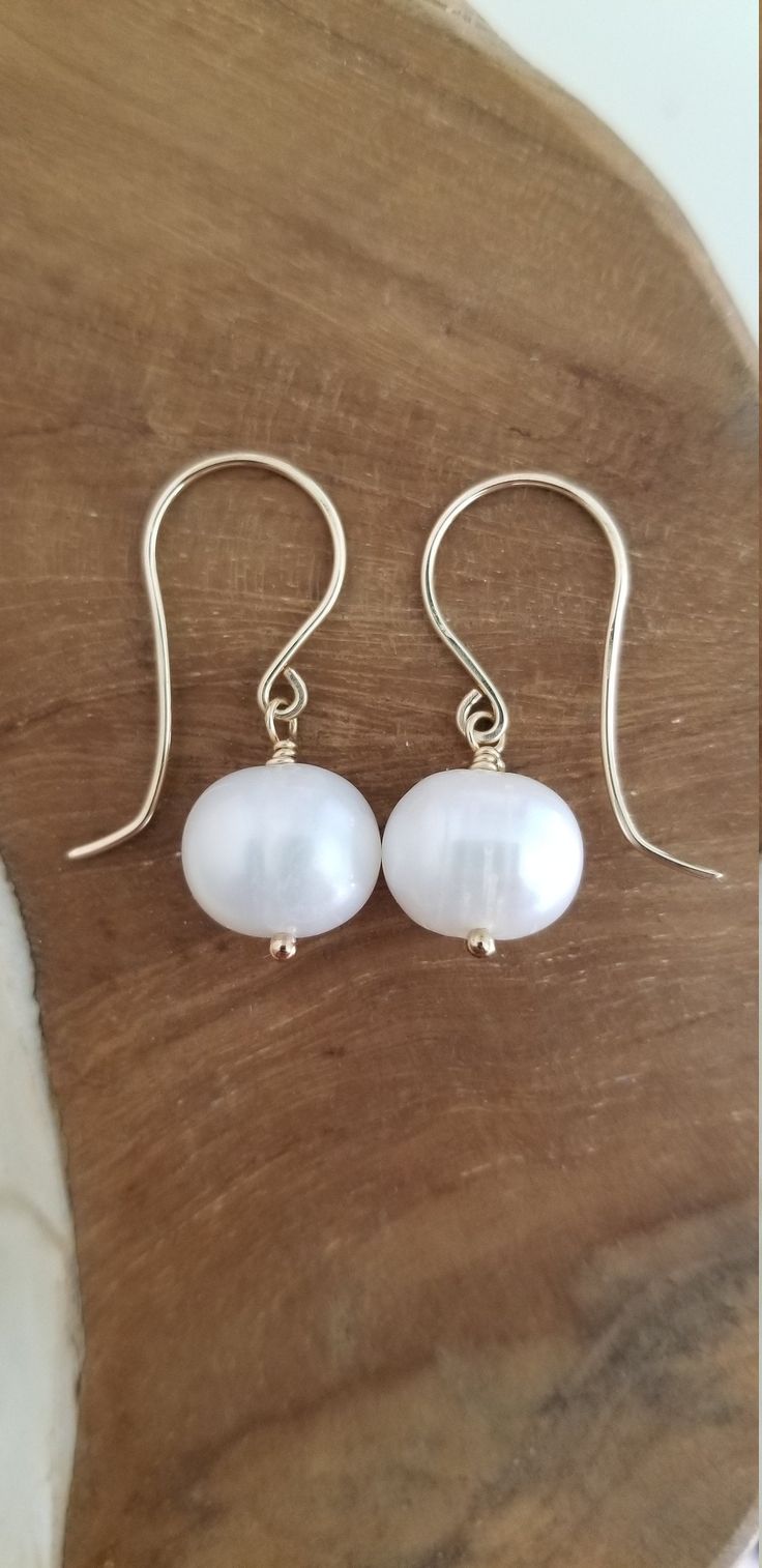 Handmade Statement Earrings with Large Freshwater Pearls, Gold Fill and Freshwater Pearl Earrings Large AAA grade cream-colored round-shaped Freshwater pearls with handcrafted ear wires.  Handcrafted with love and care. Each gemstone and pearl is a work of nature and no two are exactly alike, please allow for some variation in the tone and color. Minor inclusions or surface irregularities are also completely normal and should not be considered a defect. Should you find yourself to be unhappy wit Pearl White Round Earrings For Everyday, Everyday Round Hypoallergenic Pearl Earrings, Everyday Hypoallergenic Round Pearl Earrings, Everyday White Round Pearl Earrings, Everyday White Pearl Drop Earrings, Classic Adjustable Drop Pearl Earrings, Everyday White Pearl Earrings, Everyday Pearl Charm Earrings, Classic Handmade Pearl Earrings