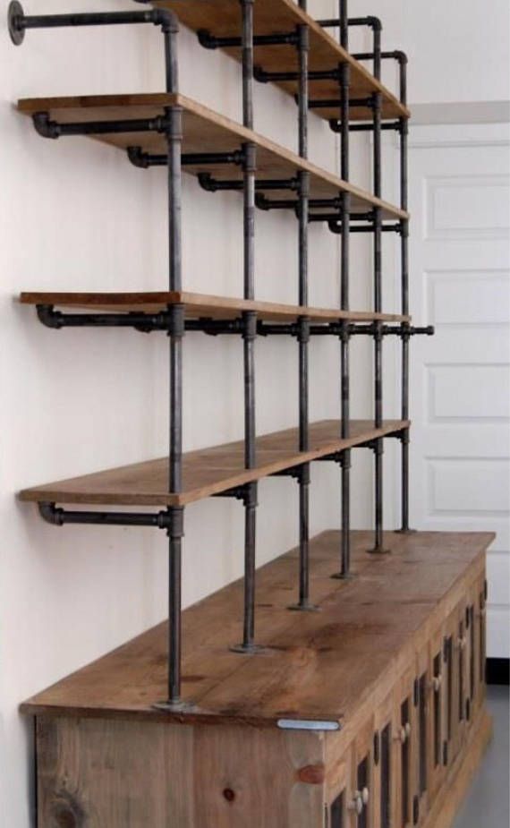 a wooden shelf with metal pipes on it