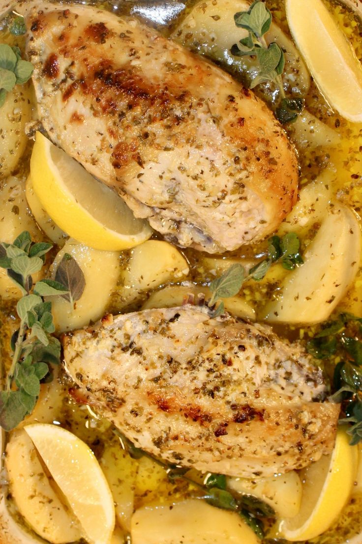 chicken with potatoes and herbs in a pan