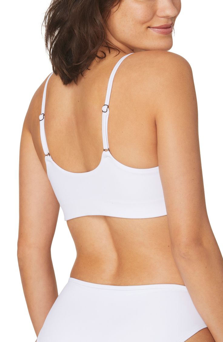 A seamless design lends comfortable support to this bikini top in a fiery solid hue. Lined   80% recycled nylon, 20% spandex   Hand wash, dry flat   Imported Athleisure Elastane Swimwear, Bra Friendly, Seamless Elastane Swimwear For Workout, White Seamless Sports Bra With Minimal Stretch, Stretch Bra With Built-in Support For Poolside, Seamless Triangle Crop Top For Yoga, Seamless Triangle Crop Top For Workout, Seamless Triangle Yoga Crop Top, Workout Triangle Crop Top With Bra Support, Workout-friendly Triangle Crop Top