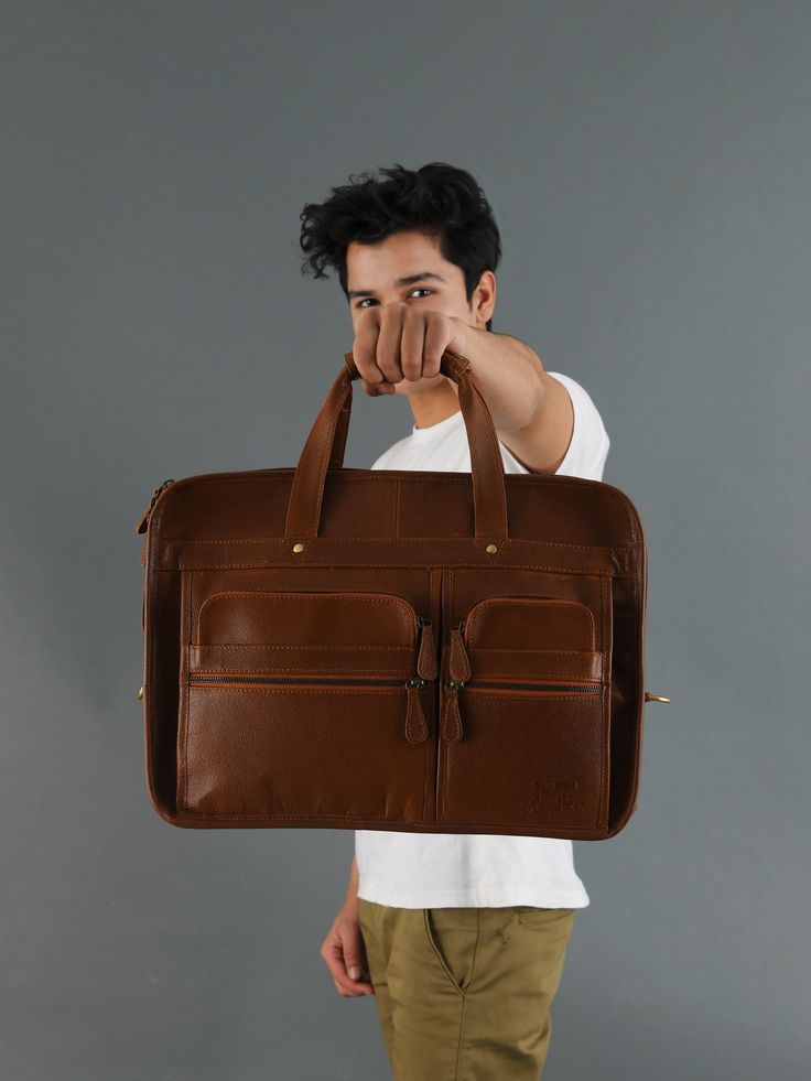 Trustpilot Our Captain Messenger Briefcase Bag is perfectly planned for your professional outlook whether you are going to the office or for a business meeting. It will offer you a unique, assertive identity, and even adds on a proper definition of an optimistic personality that keeps you standing out from the crowd. The bag is crafted from premium buffalo leather with multiple compartments which makes it super spacious and perfect to organize your travel essentials in a comfortable and trendy m Professional Satchel With Leather Lining, Professional Laptop Bag With Leather Lining For Everyday Use, Brown Rectangular Briefcase With Luggage Sleeve, Brown Rectangular Travel Briefcase, Brown Business Bag With Laptop Sleeve, Professional Brown Laptop Bag For Everyday Use, Brown Rectangular Laptop Bag For Daily Use, Brown Everyday Briefcase Rectangular Case, Brown Cases With Luggage Sleeve For Everyday Use