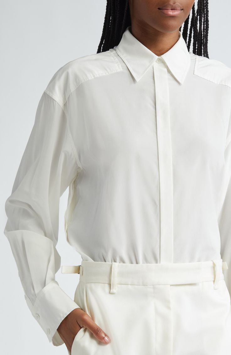 Partial yokes emphasize the dropped shoulders of this silk-enriched button-up shirt that was a featured look on the label's fall '24 runway. 29" length (size 2) Hidden-button placket Point collar Long sleeves with button cuffs 50% viscose, 42% silk, 8% elastane Dry clean Imported Designer Clothing Spring Silk Blouse For Business, Silk Business Blouse For Spring, Luxury Button-up Spring Tops, Luxury Button-up Tops For Spring, Luxury Buttoned Shirt For Spring, Luxury Button-up Blouse With Concealed Placket, Luxury Spring Button-up Top, Luxury Button-up Blouse For Spring, Luxury Spring Shirt With Button Closure