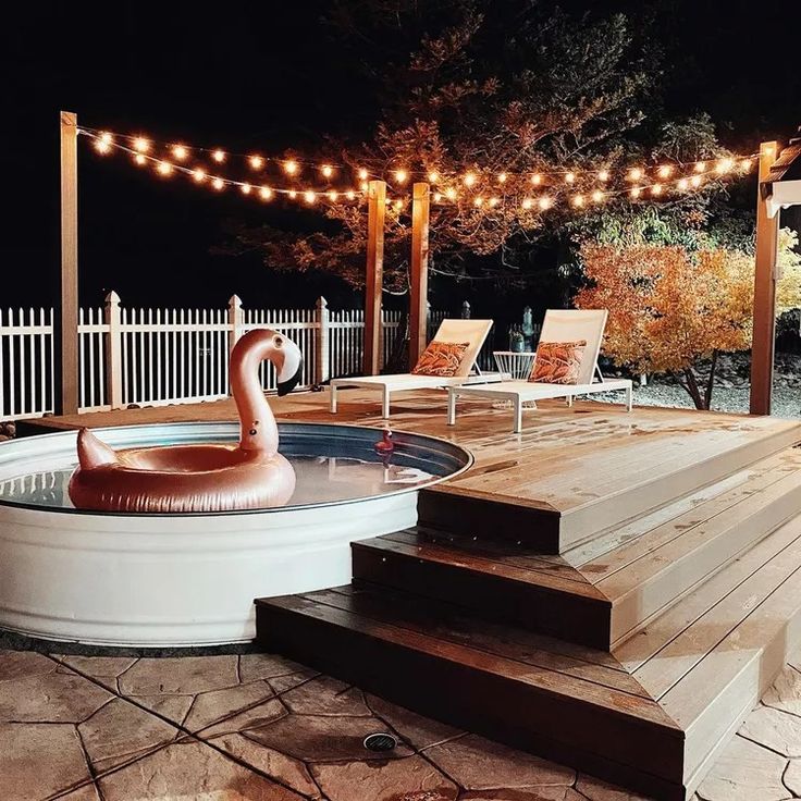 a hot tub sitting on top of a wooden deck