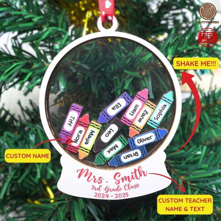 personalized christmas ornament with name and school colors on it in front of a christmas tree