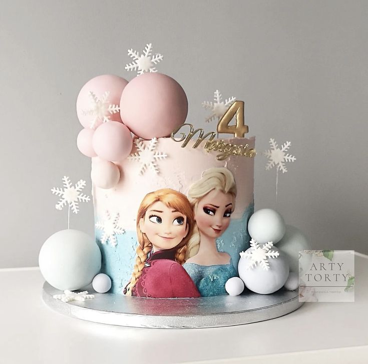 a frozen princess themed birthday cake with balloons