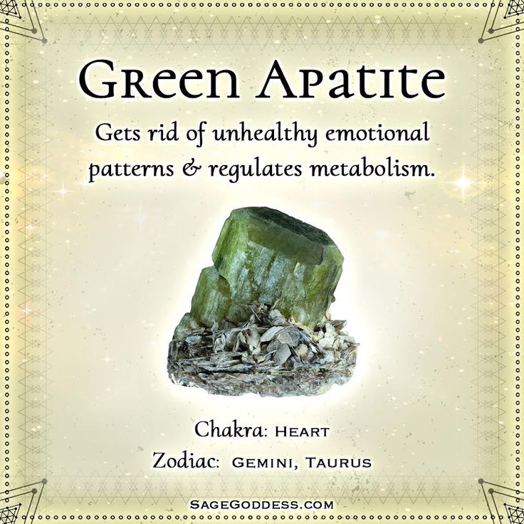 a green rock sitting on top of a pile of rocks with the words green apatie