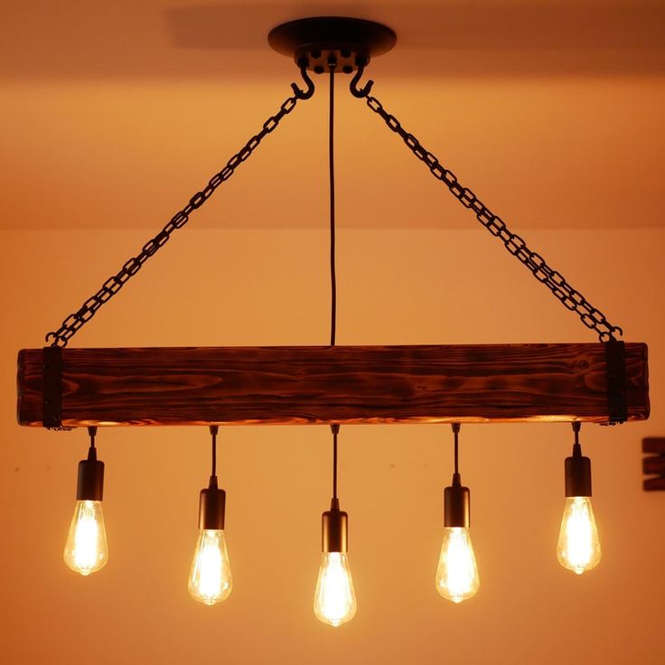 a chandelier with five light bulbs hanging from it