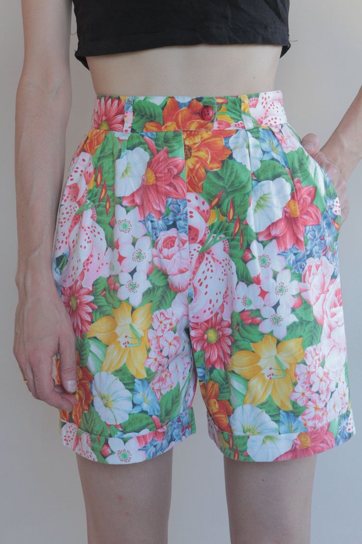 Cool Kenzo Paris multi colored floral printed high waisted shorts. Perfect 80's high fashion street wear. Fabric is a medium weight cotton. Shorts have pleats in the front, darts at the waist in back. Side front pockets. Cuff at the shorts hem. Front plastic zipper with button at the waist. Label Kenzo Paris, Size 38, 100% cotton, wash cold, hang dry. Very good vintage condition with no fabric or sewing flaws. Measurements Waist 62cm/ 24.5inches Hips 102cm/ 40inches Waist to hem 44cm/ 17inches M Retro Printed Bottoms For Spring, Retro Floral Print Bottoms For Spring, Vintage Printed Bottoms For Spring, Retro Summer Floral Print Bottoms, Retro Floral Print Summer Bottoms, Multicolor Bermuda Bottoms For Spring, Multicolor Floral Print Cotton Shorts, Summer Floral Print High-waisted Shorts, Fitted Floral Print Shorts For Summer