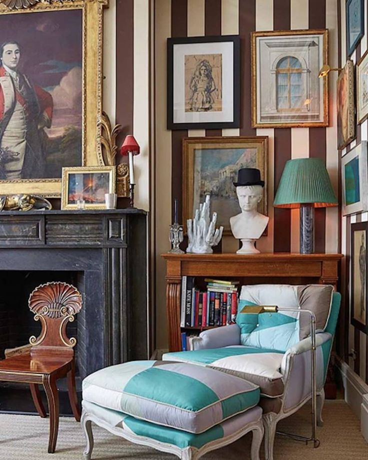 a living room filled with furniture and pictures on the wall above a fire place in front of a fireplace