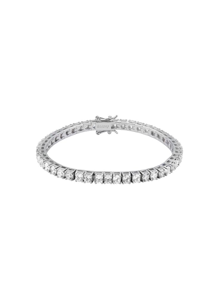 Now in 3.75MM stones, the single-strand diamond bracelet is reimagined with individually set round cut lab-grown white sapphires to elevate your every look or complete your set if you already own the Kate necklace. You can shop the Kate bracelet in 3MM stones here. The Fine Print: Metal: Sterling Silver Setting: 4-pron White Gold Tennis Bracelet With Lab Grown Diamonds, White Gold Lab-grown Diamond Tennis Bracelet With Prong Setting, White Gold Lab Grown Diamond Tennis Bracelet, White Gold Tennis Bracelet With Lab-grown Diamonds, Sterling Silver Tennis Bracelet Vvs Clarity Round Cut, Round Cut Cubic Zirconia Tennis Bracelet In White Gold, White Gold Cubic Zirconia Tennis Bracelet Round Cut, White Gold Cubic Zirconia Round Cut Tennis Bracelet, White Gold Tennis Bracelet With Cubic Zirconia Round Cut