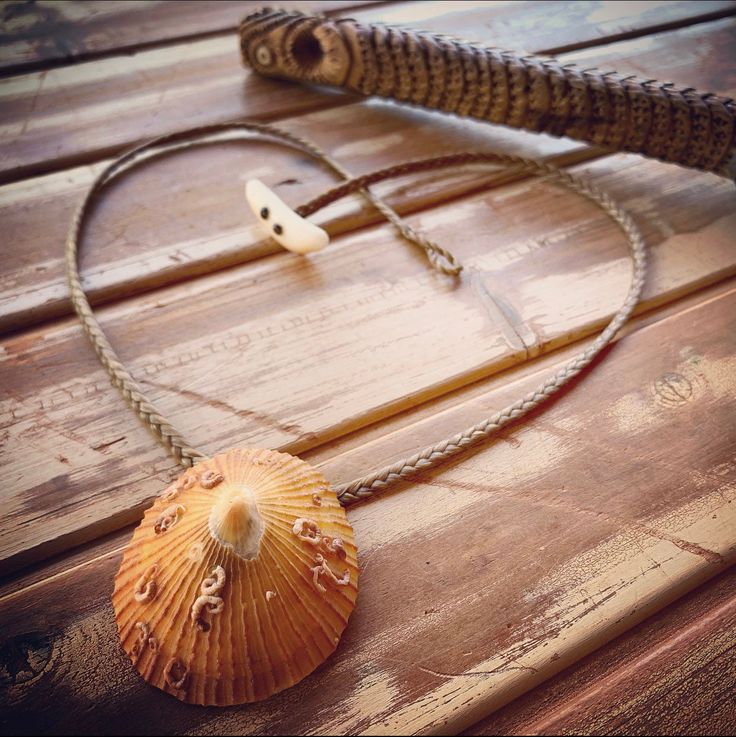 This beautiful golden opihi has been nicely tumbled by the ocean to a lovely color and texture. It measures 2 inches. I mounted it on a puka shell and it hangs on hand braided  artificial sinew. Our shells are gathered on the secluded beaches of Molokai. The necklace measures 22 inches.  Our workmanship is guaranteed for life.  Made with Aloha on the Island of Molokai. Custom orders are always available. Marine Jewelry, Shell Locket, Deer Antler Jewelry, Jellyfish Necklace, Tahitian Pearl Bracelet, Antler Earrings, Antler Jewelry, Sea Jewelry, Heavy Earrings