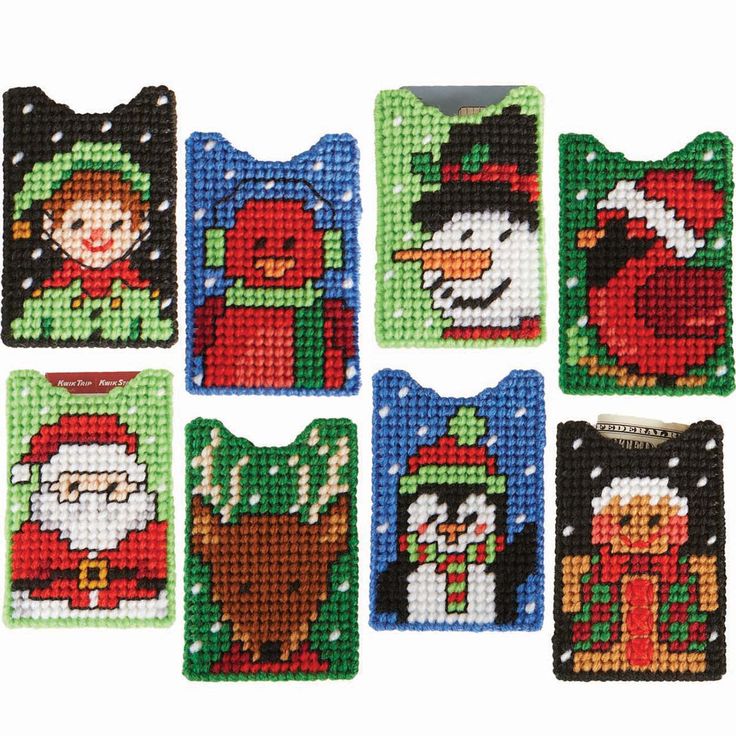 cross stitch christmas coasters with santa, snowman and penguin designs on each one