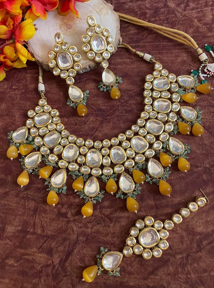 Elegant Yellow Kundan Jewelry, Gold Bridal Necklace With Mirror Work As Gift, Festive Yellow Jewelry Sets As Gifts, Festive Yellow Jewelry Sets As A Gift, Festive Yellow Jewelry Sets For Gift, Gold Kundan Bridal Necklace With Mirror Work, Gold Necklace With Mirror Work For Festivals, Gold Necklace With Mirror Work For Diwali, Gold Necklaces With Mirror Work For Diwali