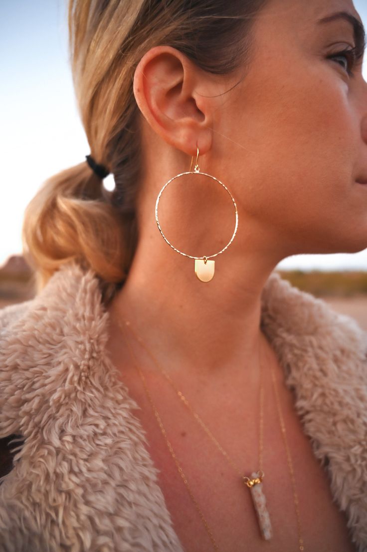 "These 14k gold fill geometric hoops are every girl's dream. As light as a feather, you can wear these from day into the evening. They're classic, chic, and effortless. The half-circle dangle charm is the cutest little addition to the hoop that makes it unique and full of magic. ▲ 14k gold fill 2\" hoops ▲ 24k gold plated brass charm ▲ Drop length: 3\" ▲ Weight: 1/8 oz ▲ Hypoallergenic ▲ Gift-ready in a beautiful white jewelry box ▲ Handmade just for you SHOP FIERCE FORWARD JEWELRY: https://www. Minimalist Teardrop Metal Hoop Earrings, Minimalist Metal Teardrop Hoop Earrings, Hypoallergenic Dangle Hoop Earrings For Everyday, Single Hoop Earring In 14k Gold Filled, Minimalist Hypoallergenic Dangle Hoop Earrings, Single Hoop Threader Earring As Gift, Pierced Minimalist 14k Gold Filled Hoop Earrings, Minimalist Dangle Hoop Earrings, Minimalist 14k Gold Filled Pierced Hoop Earrings