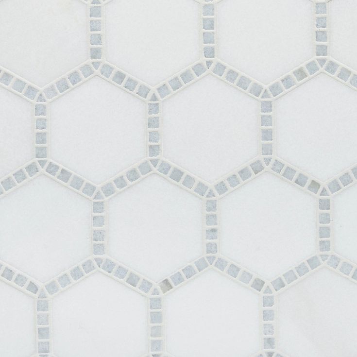 a white and grey hexagonal tile pattern