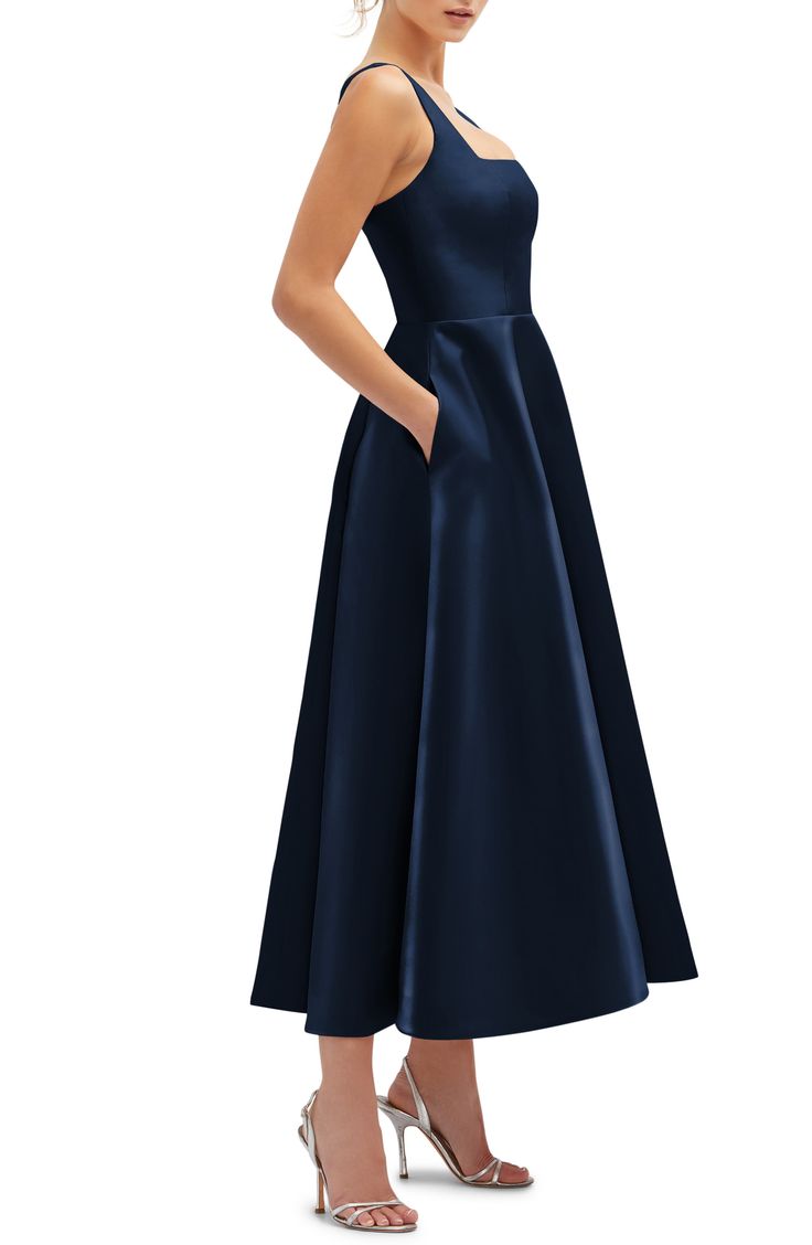 Take inspiration from the full-skirted silhouettes of the 1950s in this sleek sateen gown shaped with a fitted waist and topped with a sharply squared neckline. 49 1/2" length (size 8) Hidden back-zip closure Square neck Side-seam pockets Lined 100% polyester Machine wash, tumble dry Imported Midi Gown, Midi Gowns, Dessy Collection, Squared Neckline, Trumpet Gown, Square Neck Dress, Chiffon Gown, Chiffon Long Sleeve, Midi Dress Sleeveless