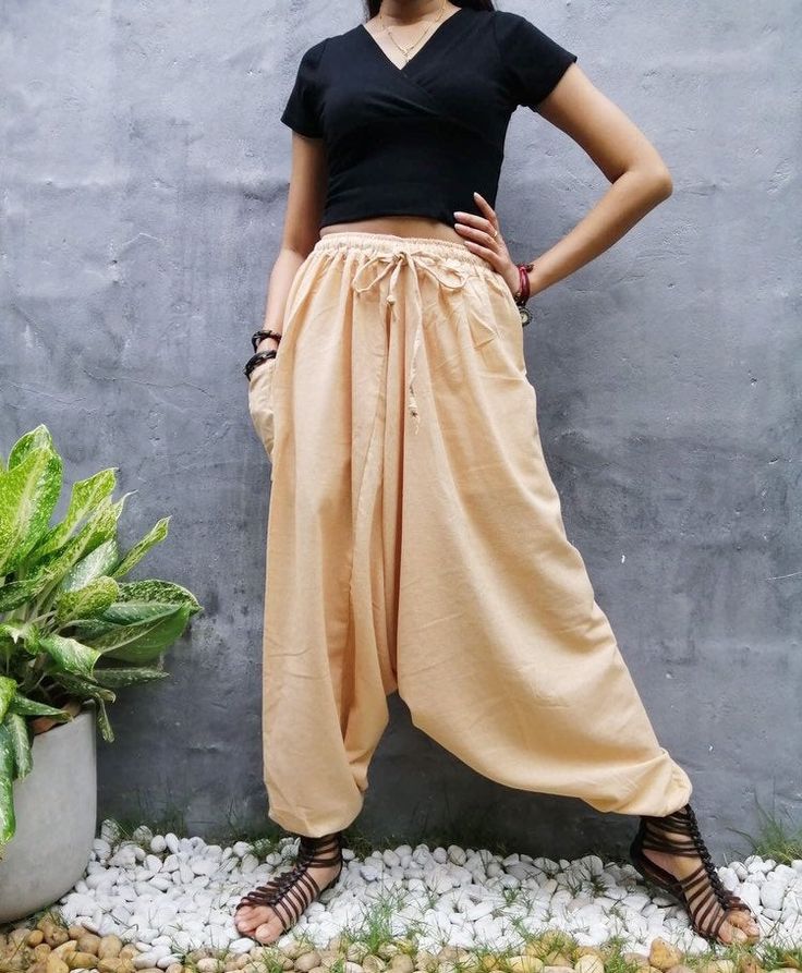 "The harem style trousers made from cotton fabric 100%with an elasticated smock waist and ankles they provide a comfortable lightweight fit, perfect for casual wear, festivals, yoga, holidays as well as pairing with a plain top to get that popular look. D I S C O U N T & P R O M O T I O N ❤ Buy 2 or more items, get 10% off ❤ Buy 4 or more items, get 15% off ENTER the coupon code: IYARA015 ❤ Buy 6 or more items, get 15% off ENTER the coupon code: IYARA020 PLEASE NOTE I can not apply a discoun Beige Cotton Harem Pants For Summer, Casual Harem Pants For Festivals, Casual Festival Harem Pants, Beige Ankle-length Harem Pants With Elastic Waistband, Spring Festival Ankle-length Harem Pants, Cotton Hippie Harem Pants For Yoga, Baggy Cotton Harem Pants Ankle-length, Baggy Cotton Ankle-length Harem Pants, Bohemian Cotton Parachute Pants For Yoga